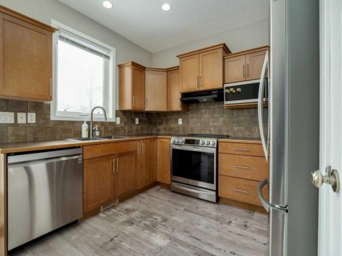 146 Silkstone Road West, Lethbridge, AB - Indoor Photo Showing Kitchen With Double Sink