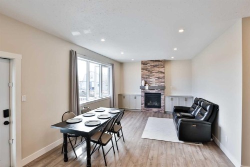 311 S 100 W, Raymond, AB - Indoor Photo Showing Other Room With Fireplace