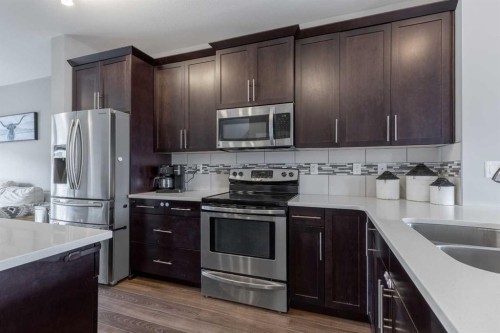 539 Moonlight Lane West, Lethbridge, AB - Indoor Photo Showing Kitchen With Double Sink