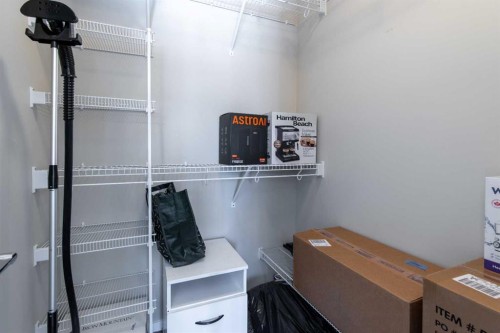 5-418 Highlands Boulevard West, Lethbridge, AB - Indoor With Storage