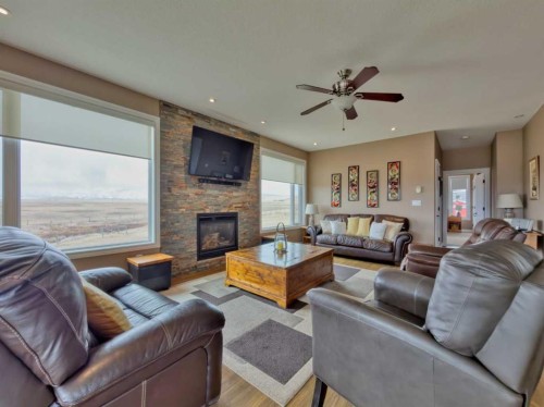 5 Walking Plow Estates, Cowley, AB - Indoor Photo Showing Living Room With Fireplace