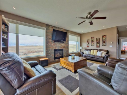 5 Walking Plow Estates, Cowley, AB - Indoor Photo Showing Living Room With Fireplace