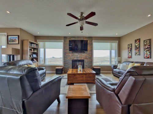 5 Walking Plow Estates, Cowley, AB - Indoor Photo Showing Living Room With Fireplace