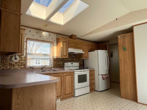 230 4 Street, Stirling, AB - Indoor Photo Showing Kitchen With Double Sink