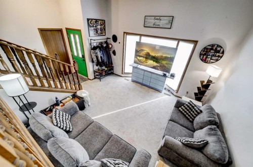 131 Beaverbrook Road North, Lethbridge, AB - Indoor Photo Showing Living Room With Fireplace