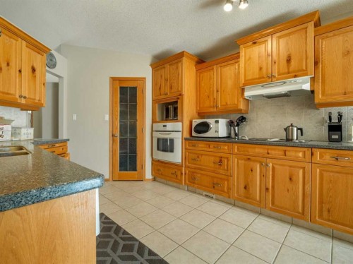 108 Riverdale Terrace West, Lethbridge, AB - Indoor Photo Showing Kitchen With Double Sink