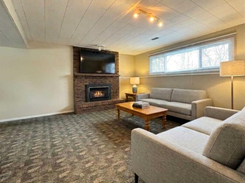 2409 20 Street North, Lethbridge, AB - Indoor Photo Showing Living Room With Fireplace