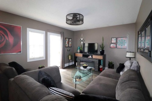 8-1739 St Edward Boulevard North, Lethbridge, AB - Indoor Photo Showing Living Room