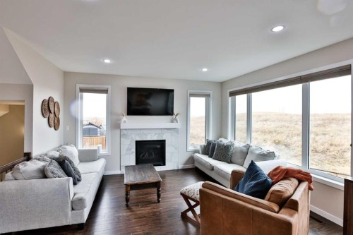 261 Agnes Short Place North, Lethbridge, AB - Indoor Photo Showing Living Room With Fireplace