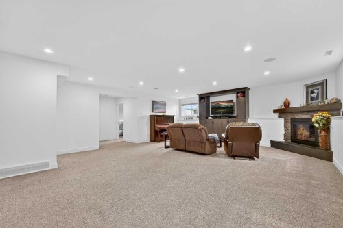 64 Riverhurst Cove West, Lethbridge, AB - Indoor With Fireplace