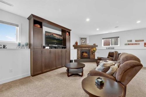 64 Riverhurst Cove West, Lethbridge, AB - Indoor Photo Showing Other Room With Fireplace
