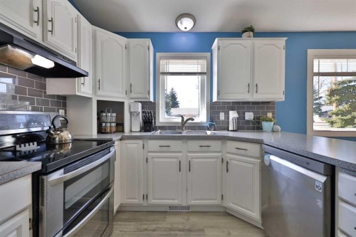 235 E 200 S, Raymond, AB - Indoor Photo Showing Kitchen With Double Sink