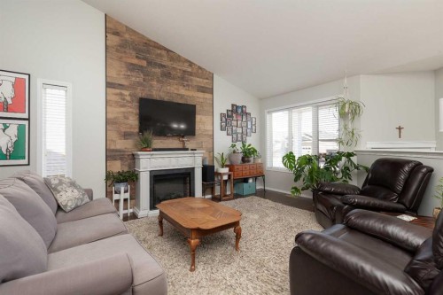 570 Edinburgh Road West, Lethbridge, AB - Indoor Photo Showing Living Room With Fireplace