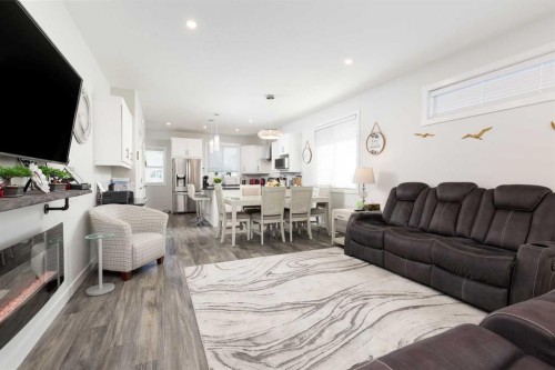 22 Rivergrove Run West, Lethbridge, AB - Indoor Photo Showing Living Room With Fireplace