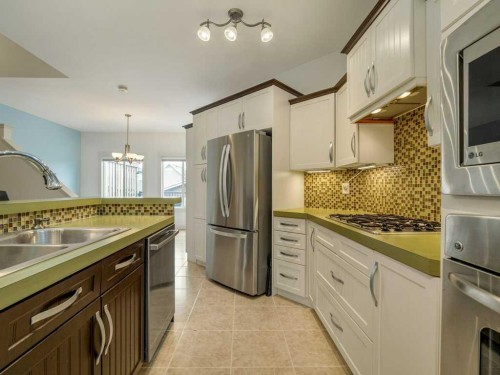406 Twinriver Road West, Lethbridge, AB - Indoor Photo Showing Kitchen With Double Sink With Upgraded Kitchen