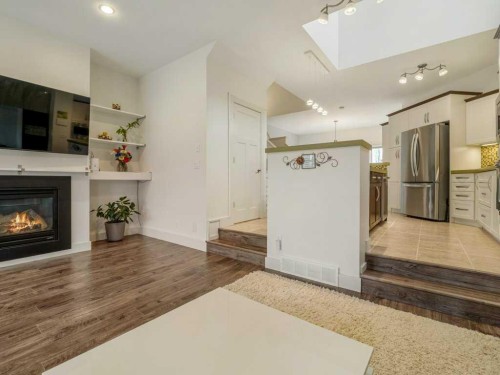 406 Twinriver Road West, Lethbridge, AB - Indoor With Fireplace