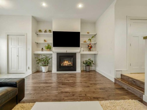 406 Twinriver Road West, Lethbridge, AB - Indoor Photo Showing Living Room With Fireplace