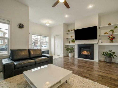 406 Twinriver Road West, Lethbridge, AB - Indoor Photo Showing Living Room With Fireplace