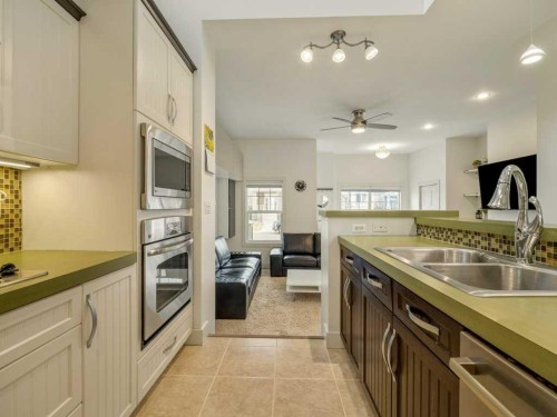 406 Twinriver Road West, Lethbridge, AB - Indoor Photo Showing Kitchen With Double Sink
