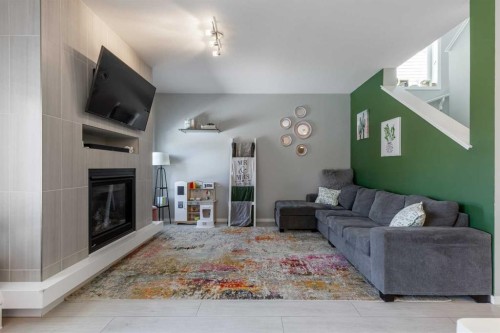 933 Pacific Way West, Lethbridge, AB - Indoor Photo Showing Living Room With Fireplace