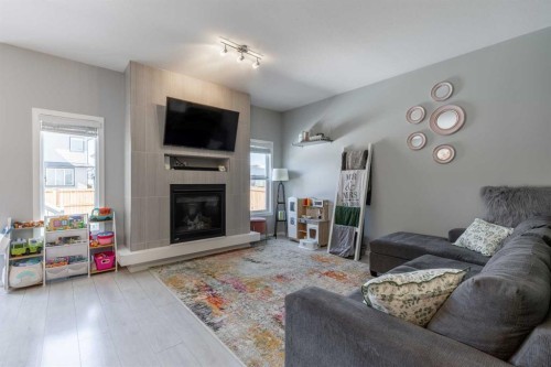 933 Pacific Way West, Lethbridge, AB - Indoor Photo Showing Living Room With Fireplace