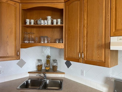 2134 21 Avenue, Coaldale, AB - Indoor Photo Showing Kitchen With Double Sink