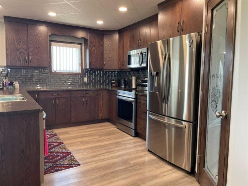 131010 Range Road 163, Vauxhall, AB - Indoor Photo Showing Kitchen With Stainless Steel Kitchen