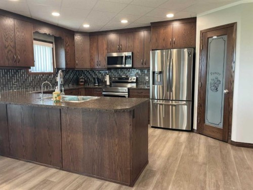 131010 Range Road 163, Vauxhall, AB - Indoor Photo Showing Kitchen With Stainless Steel Kitchen