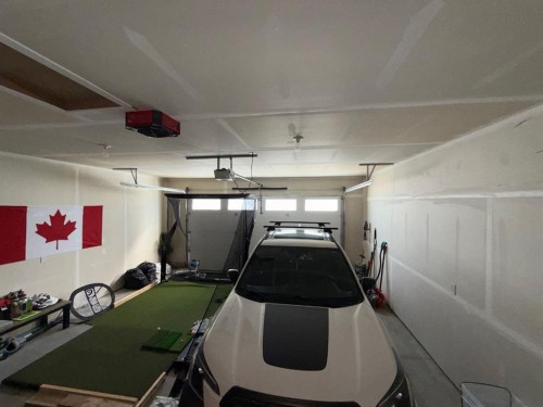 #502-1940 Parkside Way, Coaldale, AB - Indoor Photo Showing Garage