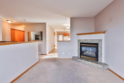 38 St James Crescent North, Lethbridge, AB - Indoor Photo Showing Living Room With Fireplace