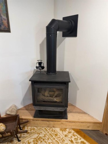 205 Hamilton Avenue, Lundbreck, AB - Indoor Photo Showing Living Room With Fireplace