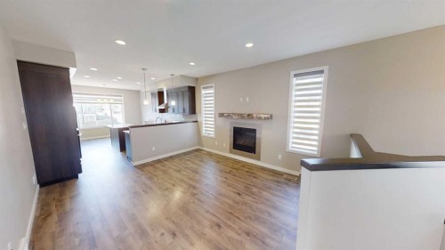 929 Atlantic Cove West, Lethbridge, AB - Indoor Photo Showing Other Room With Fireplace