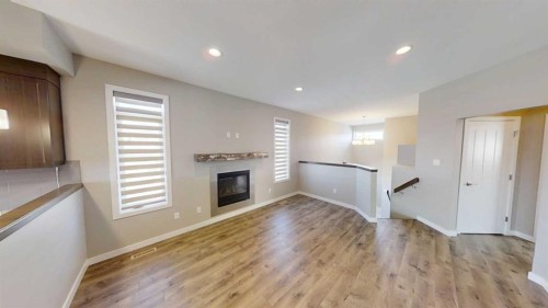 929 Atlantic Cove West, Lethbridge, AB - Indoor Photo Showing Living Room With Fireplace