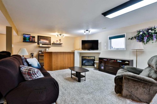 263 Red Crow Boulevard West, Lethbridge, AB - Indoor Photo Showing Living Room With Fireplace