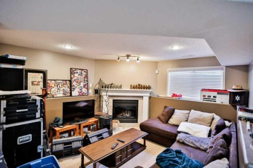 41 Lynx Place North, Lethbridge, AB - Indoor With Fireplace