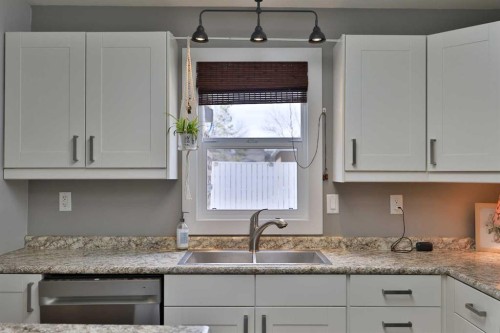 28 E 100 S, Raymond, AB - Indoor Photo Showing Kitchen With Double Sink