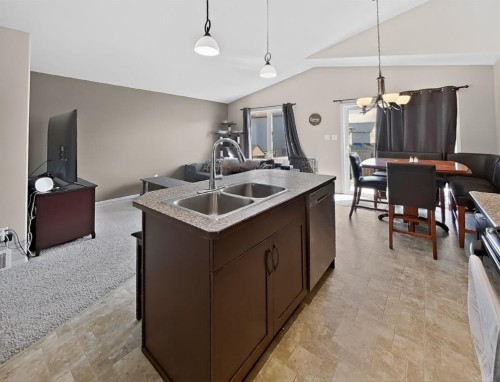 711 Sunset Place, Coaldale, AB - Indoor Photo Showing Kitchen With Double Sink