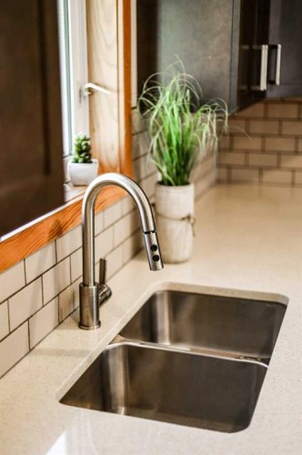 75 Ironstone Drive, Coleman, AB - Indoor Photo Showing Kitchen With Double Sink