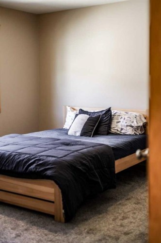 75 Ironstone Drive, Coleman, AB - Indoor Photo Showing Bedroom