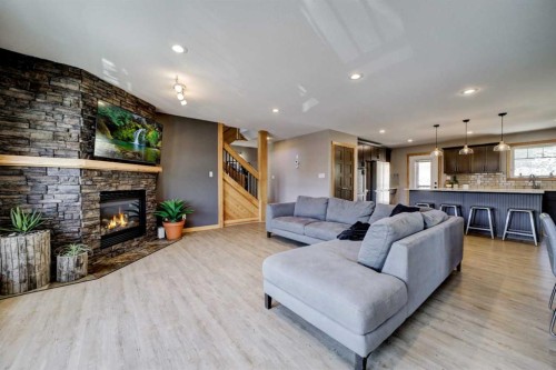 75 Ironstone Drive, Coleman, AB - Indoor Photo Showing Living Room With Fireplace
