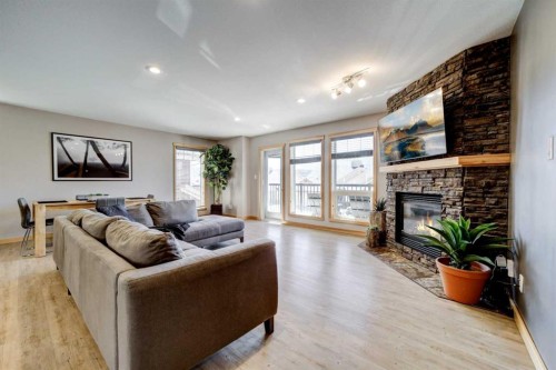 75 Ironstone Drive, Coleman, AB - Indoor Photo Showing Living Room With Fireplace