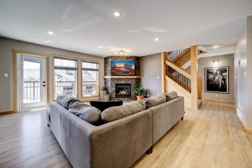 75 Ironstone Drive, Coleman, AB - Indoor Photo Showing Living Room With Fireplace