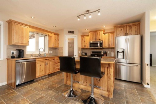 910 Centennial Avenue, Nobleford, AB - Indoor Photo Showing Kitchen With Double Sink