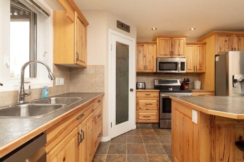 910 Centennial Avenue, Nobleford, AB - Indoor Photo Showing Kitchen With Double Sink