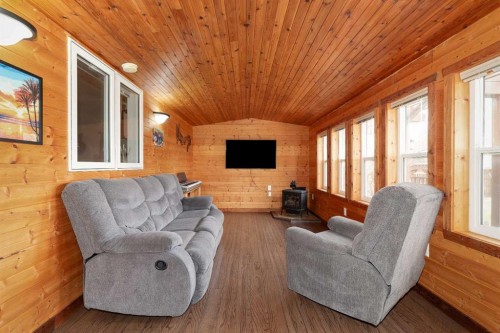 910 Centennial Avenue, Nobleford, AB - Indoor Photo Showing Living Room With Fireplace