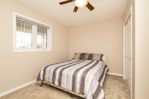 910 Centennial Avenue, Nobleford, AB - Indoor Photo Showing Bedroom