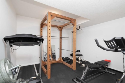 910 Centennial Avenue, Nobleford, AB - Indoor Photo Showing Gym Room