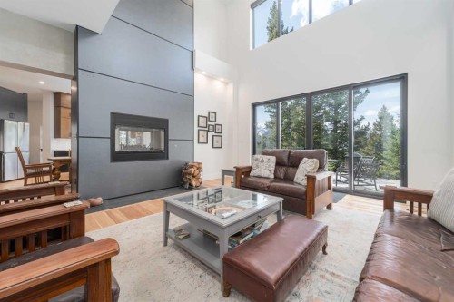 8938 24 Avenue, Coleman, AB - Indoor Photo Showing Living Room With Fireplace