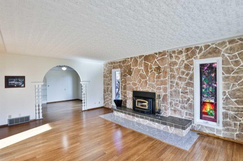 318 Mcmaster Boulevard West, Lethbridge, AB - Indoor Photo Showing Living Room With Fireplace