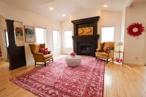 4 Heritage Point West, Lethbridge, AB - Indoor Photo Showing Living Room With Fireplace